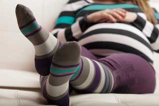 A pregnant woman feels more comfortable when she wears compression socks