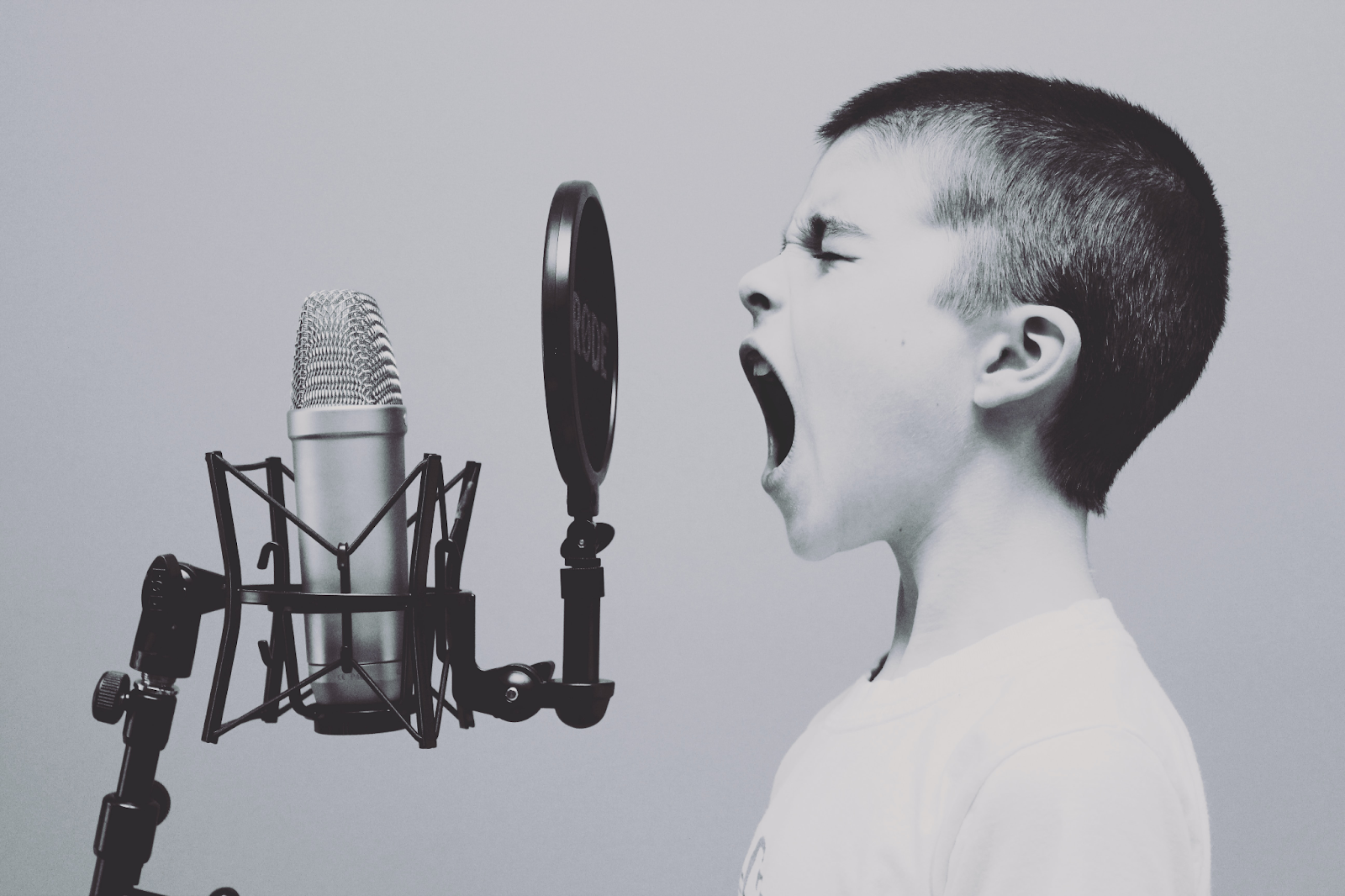 A child singing into a microphone.