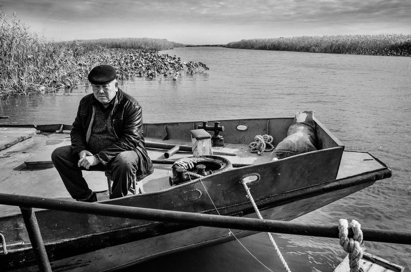 man in his boat on the Volga