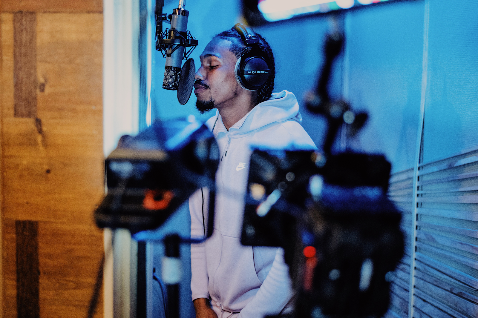 Rapper recording in a studio.