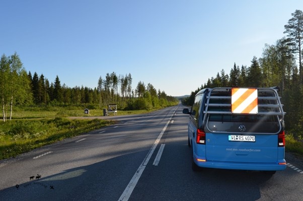 Our van in the foreground on the road that runs through the center of the town. On the sides the Swedish forest.