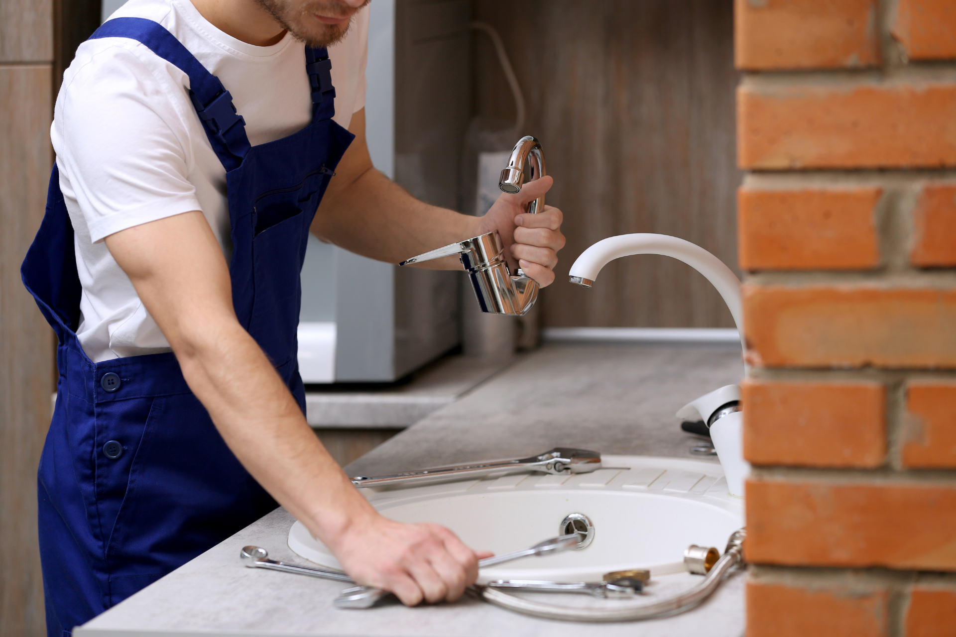 A plumbing expert installing a new faucet