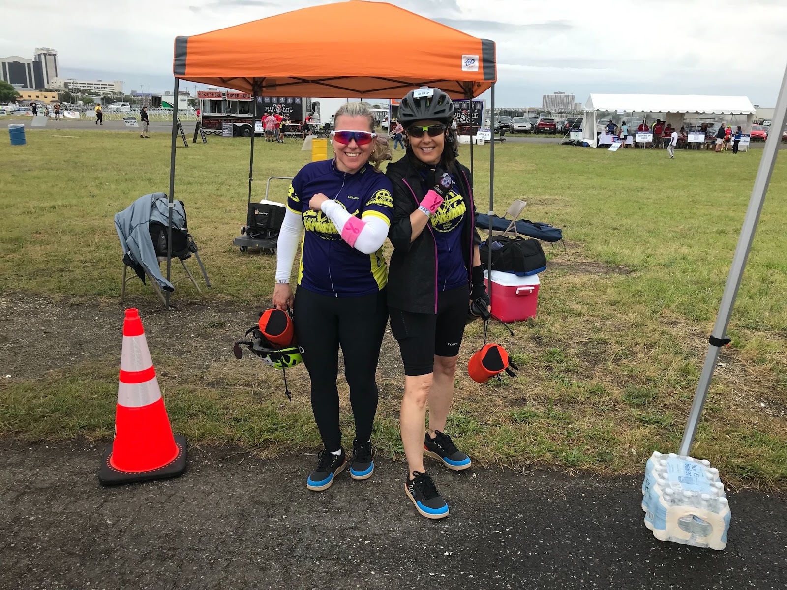Two Team WMMR riders pose for a photograph at the end of the Bike-a-thon sporting armbands in support of breast cancer. 