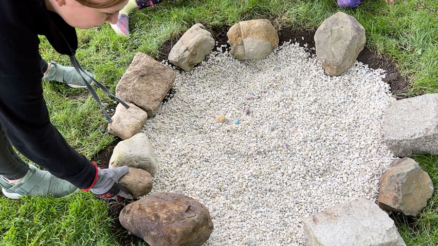 Placing a ring of rocks around the firepit
