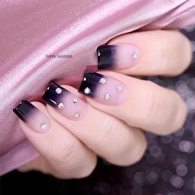Lady shows off her purple and black ombre nails 