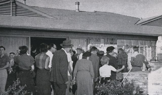 Visitors on the patio of Howdy Howard's Holiday Home in Dallas, TX, during an open house in late 1952. Originally published in the National Real Estate and Building Journal, March 1953. (NAR Archives)