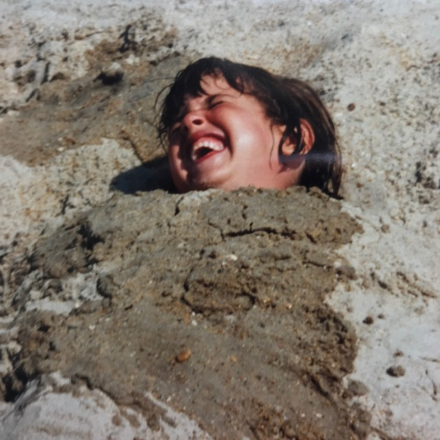 Alisa 6 years old buried in the sand