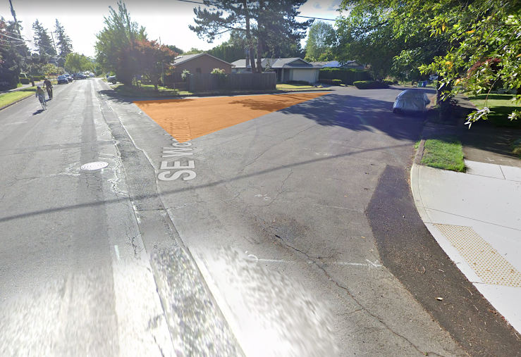 Looking northwest at intersection. Area in orange.