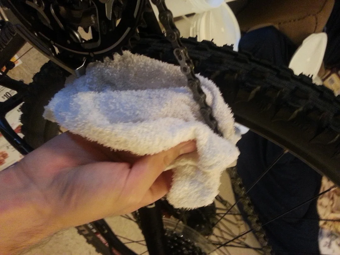 Use a rag soaked with soapy water to gently clean your chain and repeat this until your mountain bike chain is nice and clean.