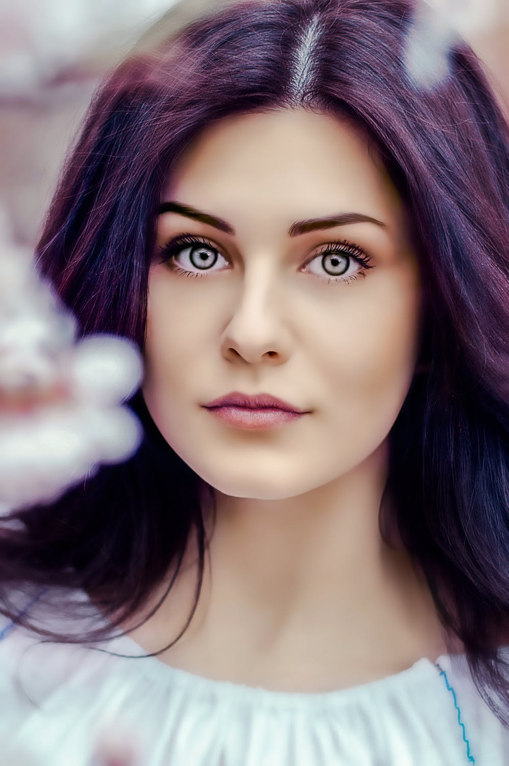 headshot of woman with purple hair
