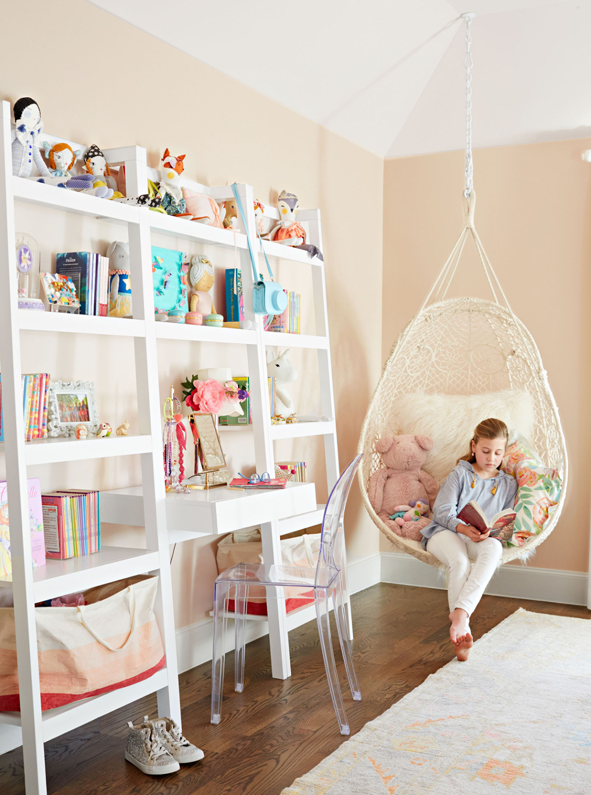 A child casually reading a book in a comfortable space at home