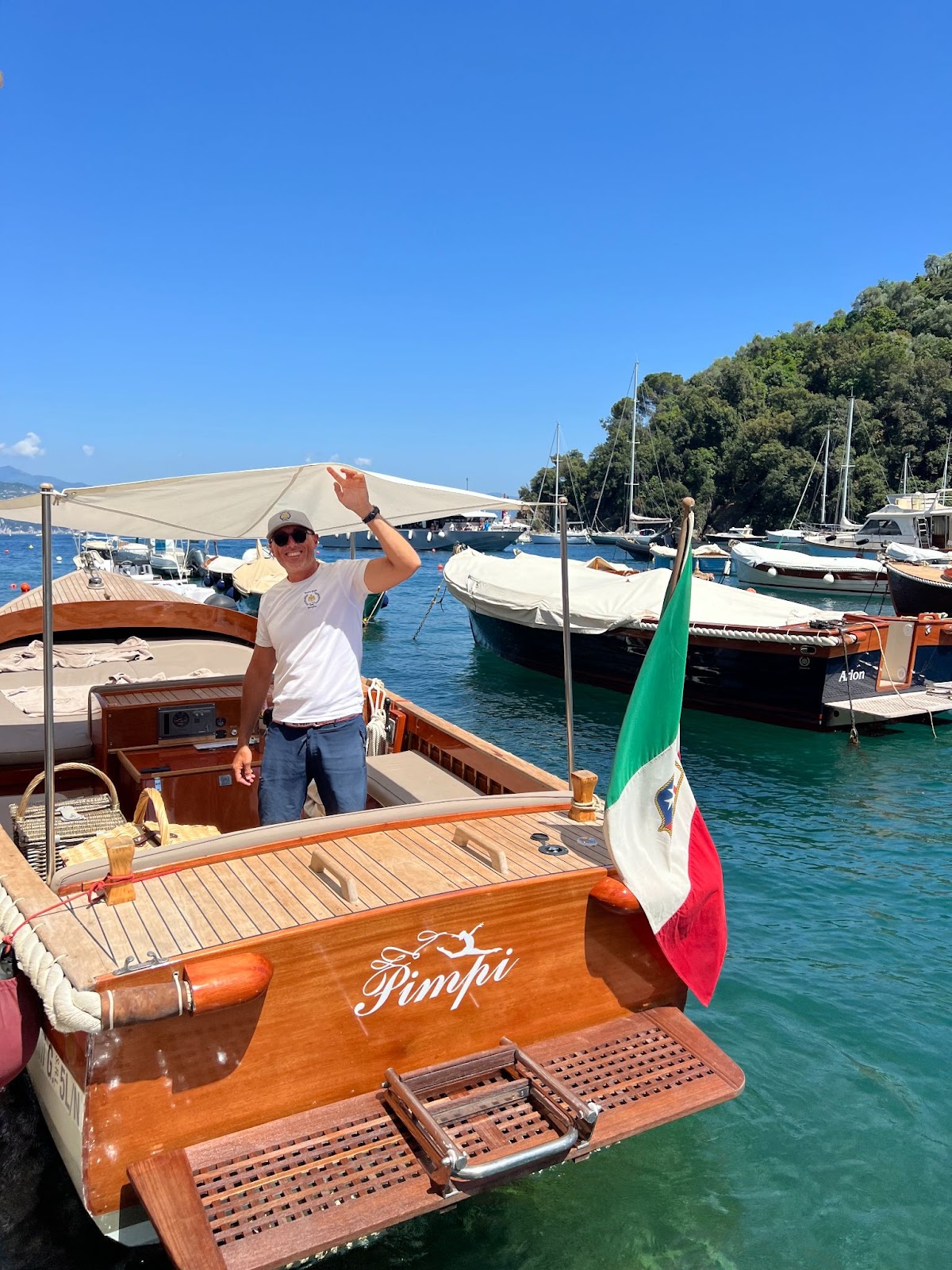 a man waving in a boat