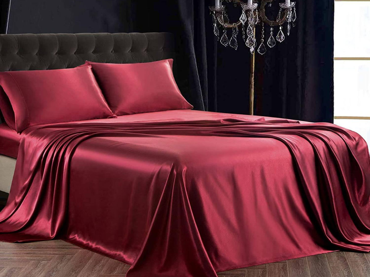 Bed with red silk sheets