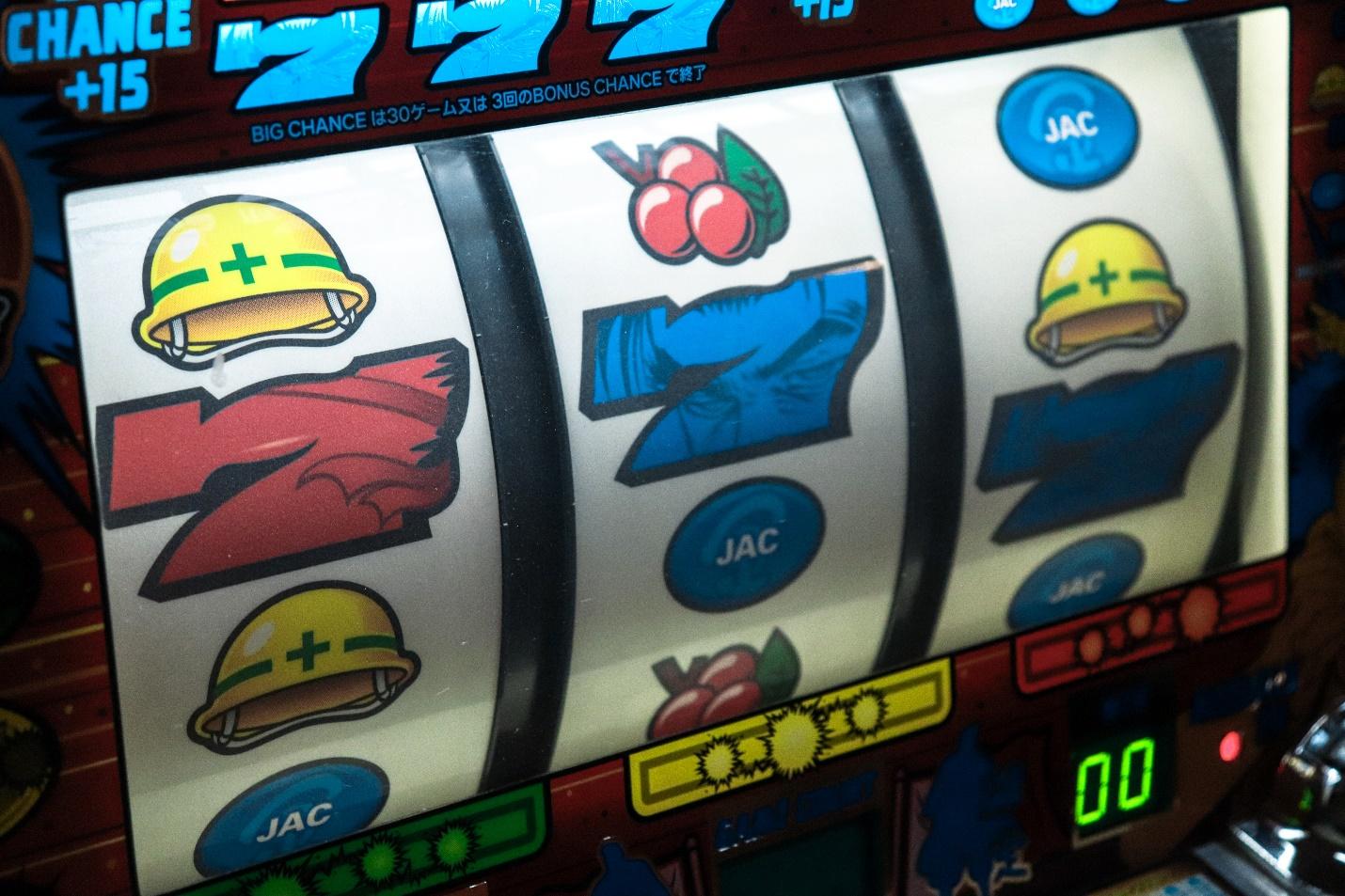 A picture containing text, slot machine  Description automatically generated