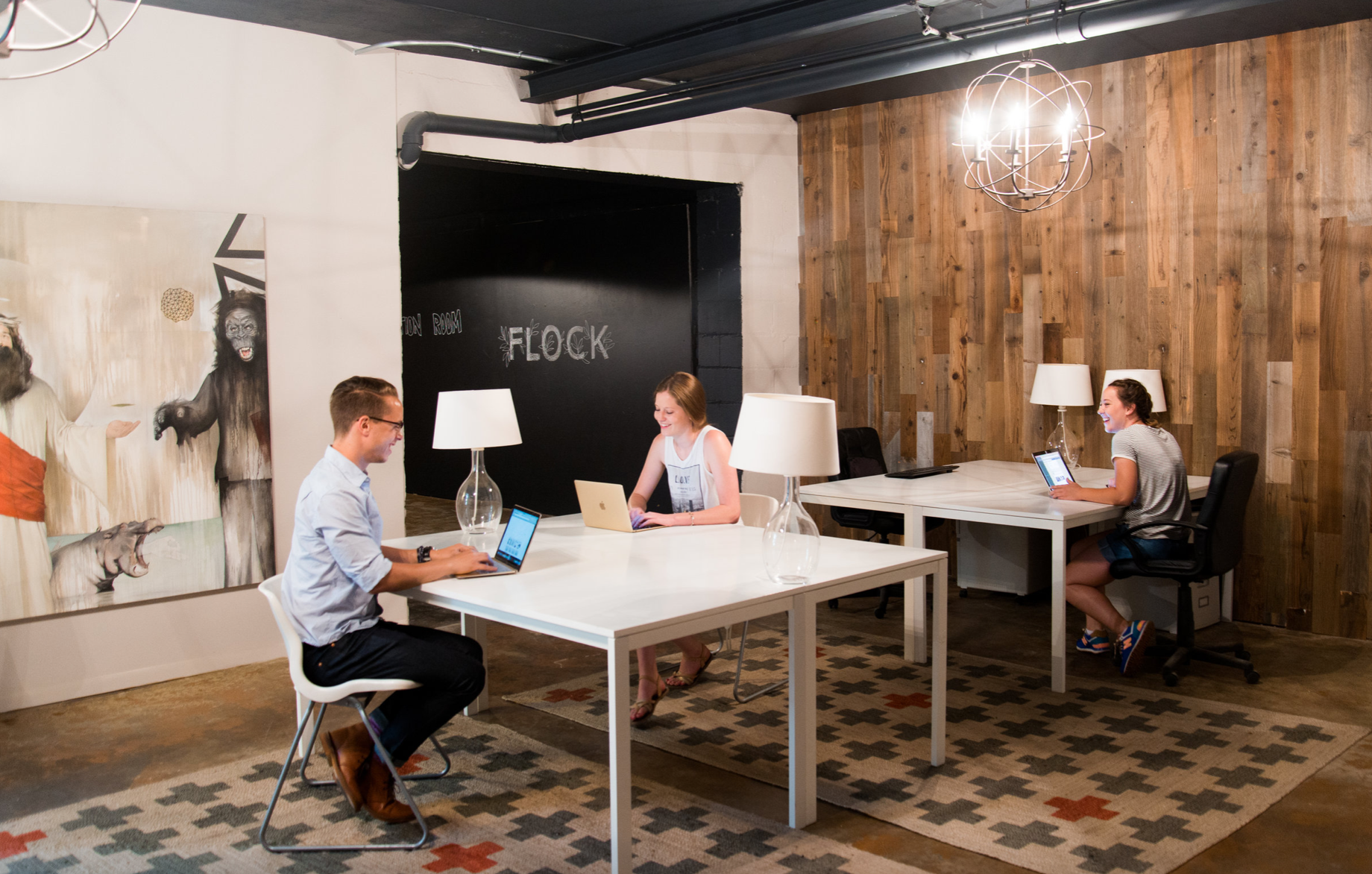 people working from a trendy looking creative coworking space in the twin cities