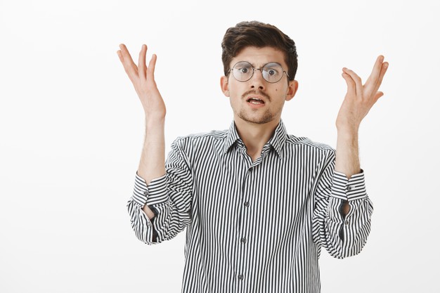 For god sake why. portrait of annoyed intense attractive european it manager in glasses, lifting palms and shaking hands nervously, being shocked and displeased with stupid mistake of coworker Free Photo