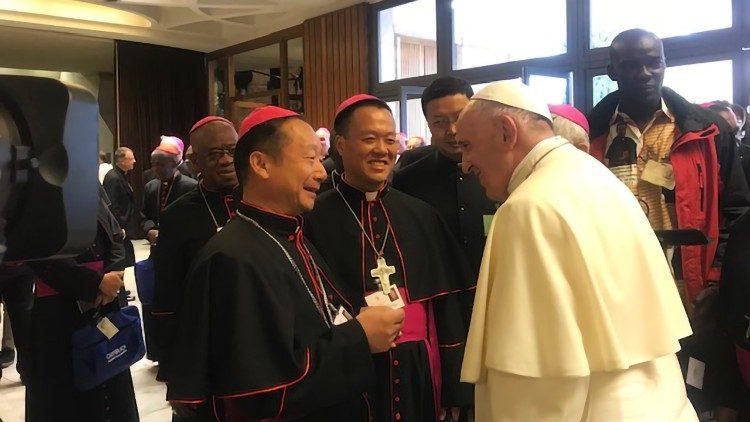 Pope Francis greets two Chinese Bishops during October Synod