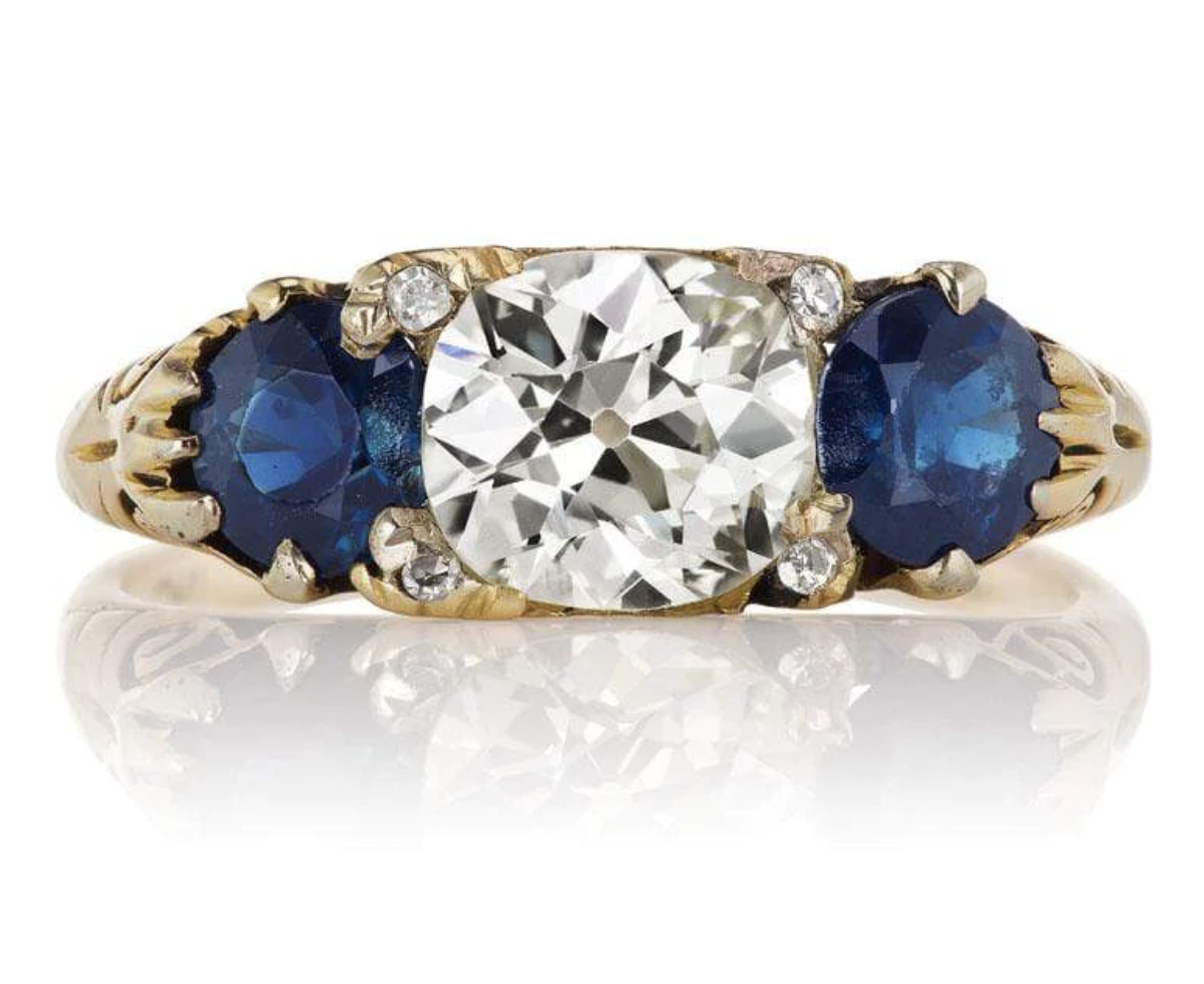 EDWARDIAN ERA DIAMOND FLANKED BY SAPPHIRES