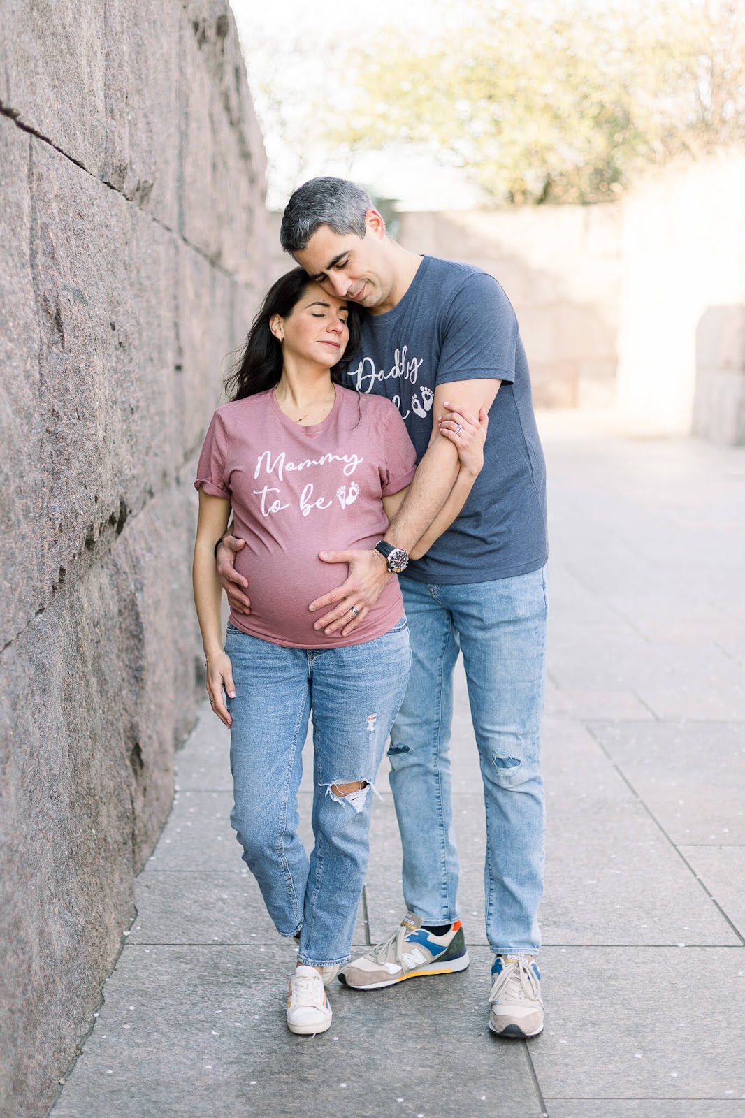 Pregnant couple embracing each other