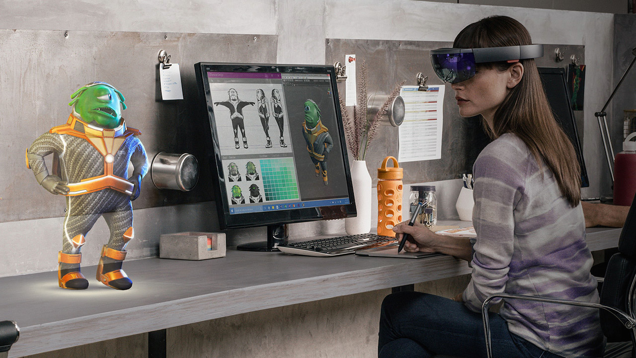 Woman sitting at her desk with VR glasses, displaying her blockchain NFT on her desk via hologram glasses that she'll later use to enter the metaverse.