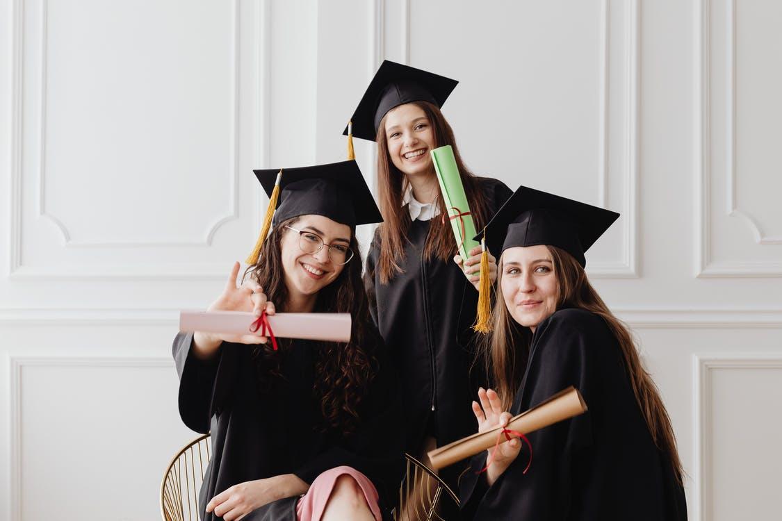 Free 2 Women Wearing Academic Dress Stock Photo