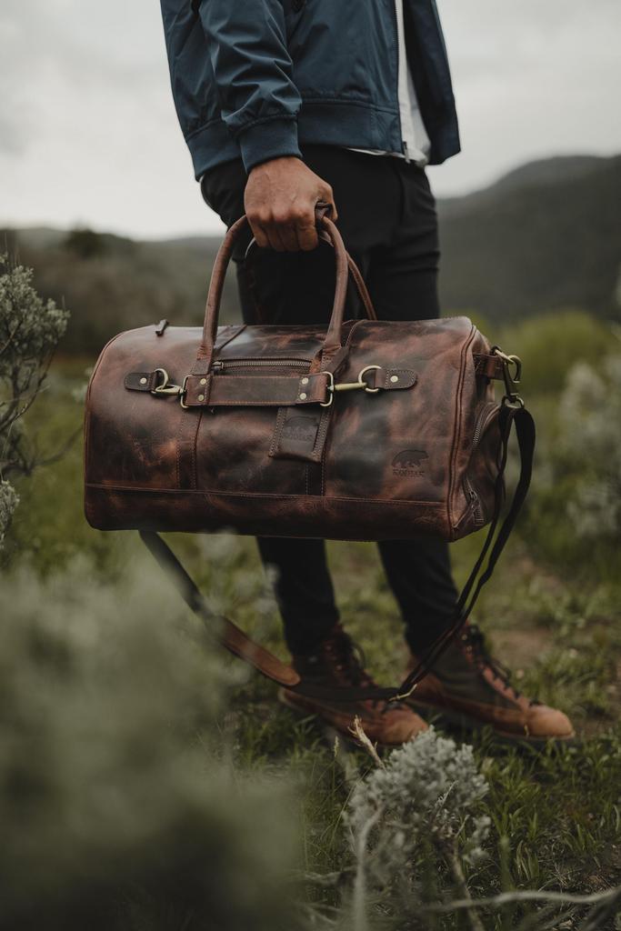 Image showing a person holding a Leather Duffel Bag