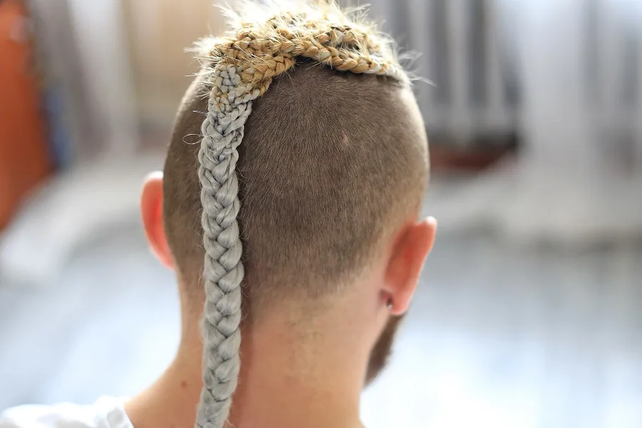 Back view of a guy rocking the feed in braids, the real viking style