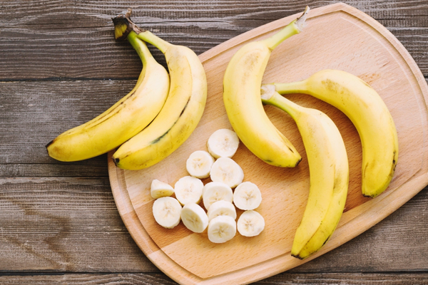A picture containing table, banana, wooden, cup

Description automatically generated