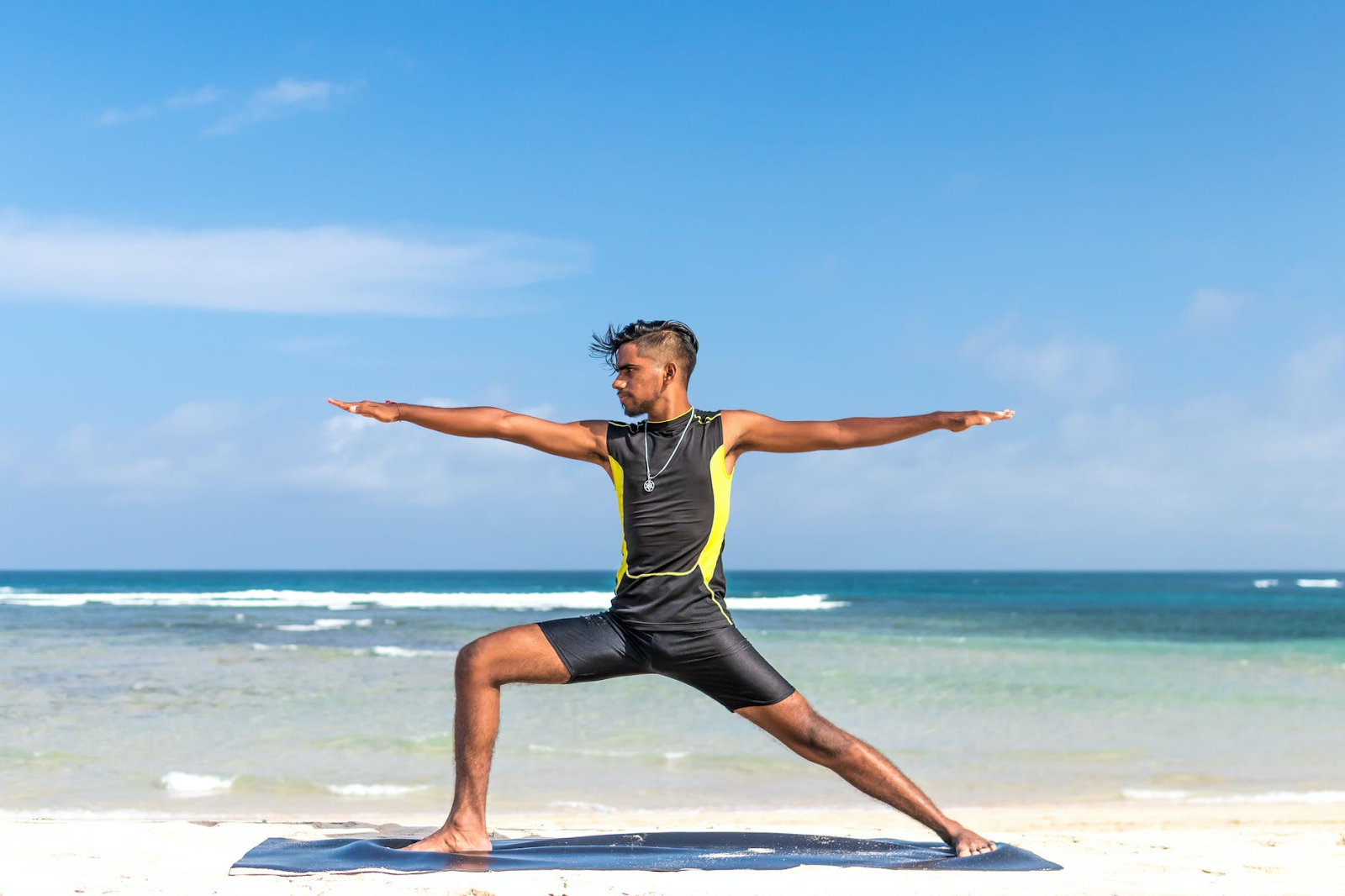 man doing yoga on the beach, investments, health, resolutions, fitness, exercise, healthy food, nutrition