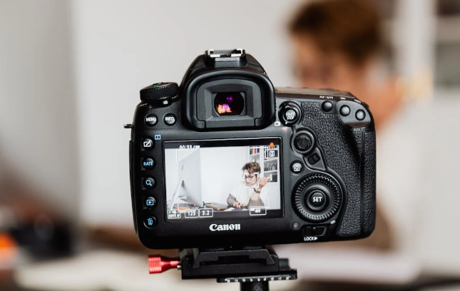 A camera recording a man.