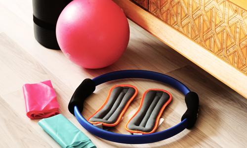 Organize your home gym equipment to make workouts easier to repeat