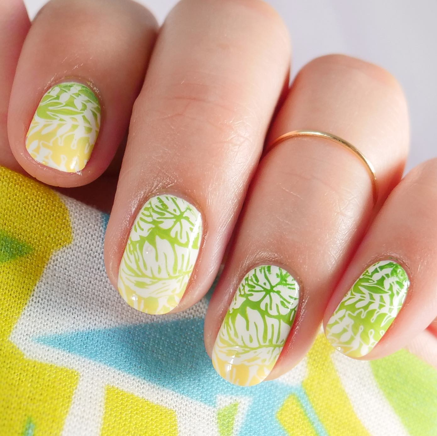 Nail art with ombre touch and tropical design