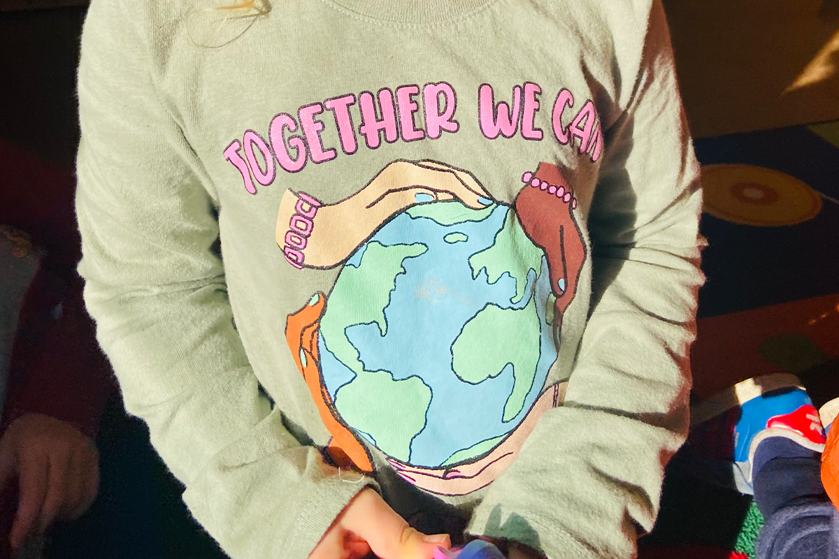 casa student wearing a shirt that says together we can for earth day