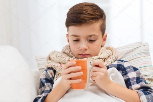 Ill boy with flu in scarf drinking tea at home ⬇ Stock Photo, Image by ©  Syda_Productions #92521378
