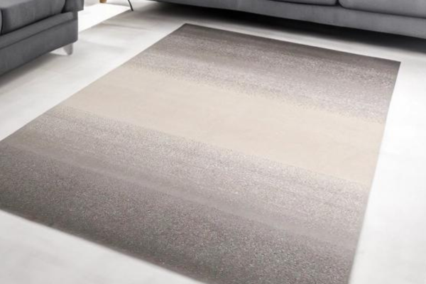 Large-sized dual-tone rug made from polypropylene yarn, featuring a fade from black to beige