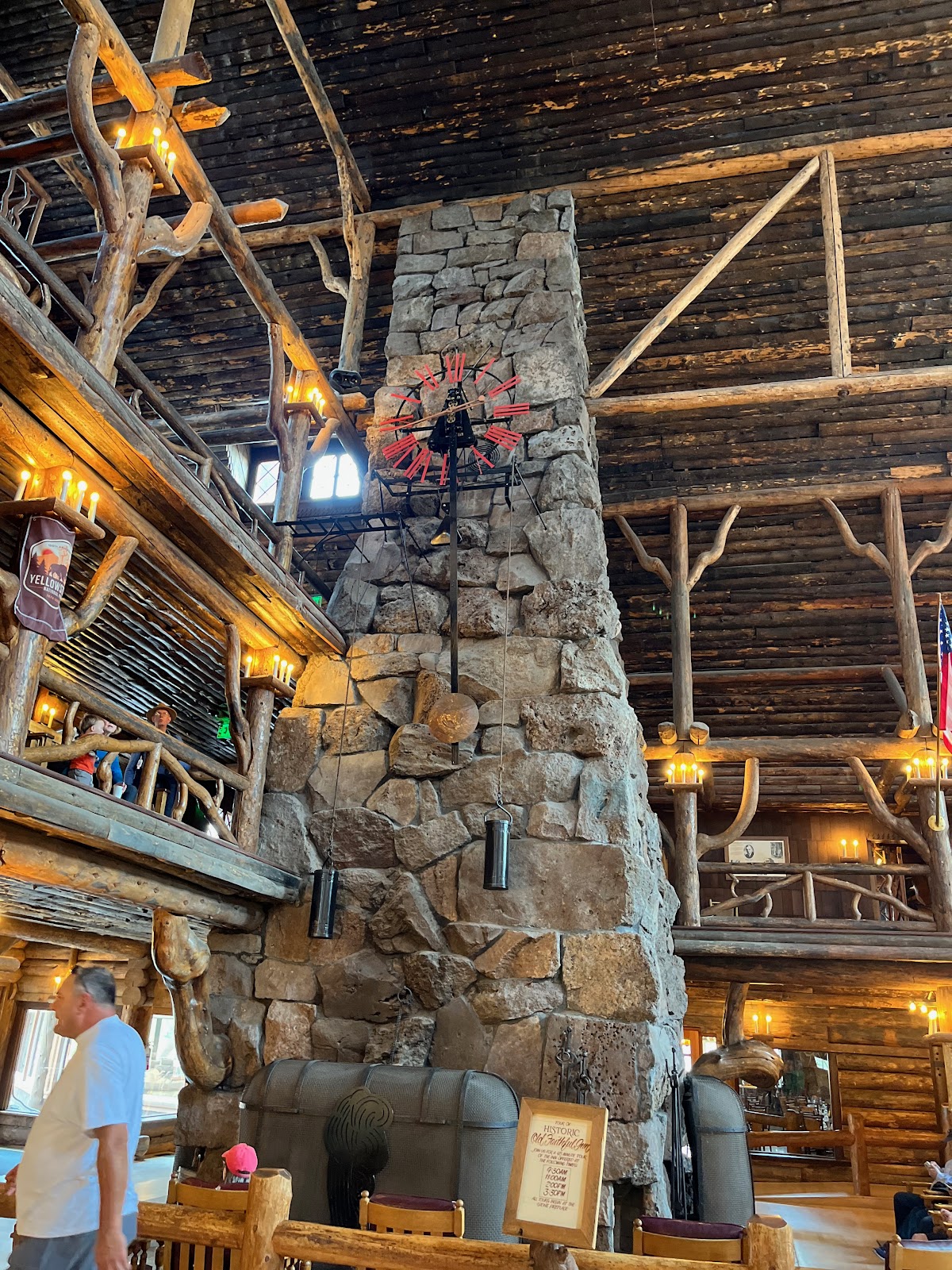 interior of an historical site in yellowstone with a clock mounted in the wall
