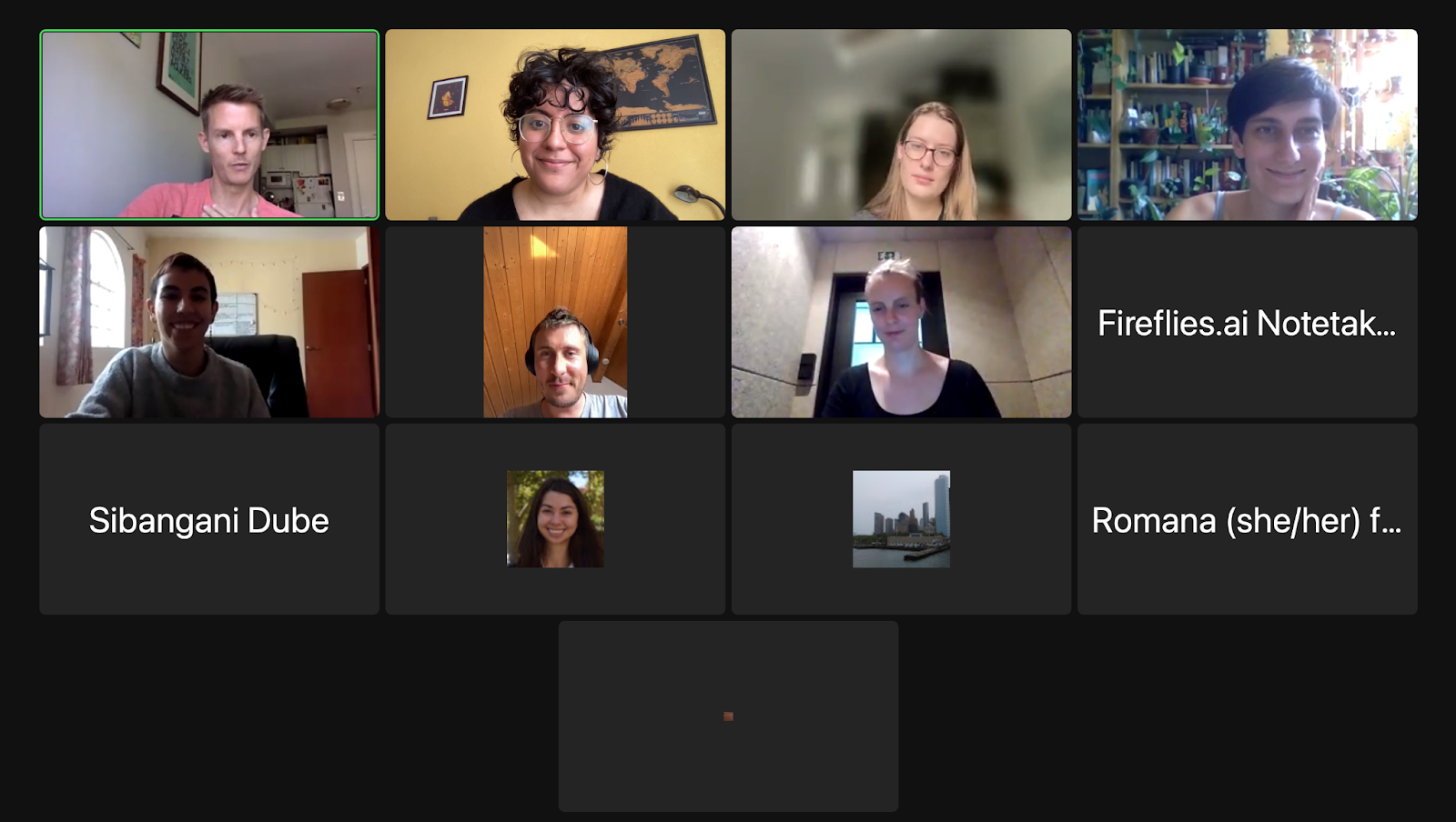 Screenshot of a Zoom meeting with the faces of several participants visible.