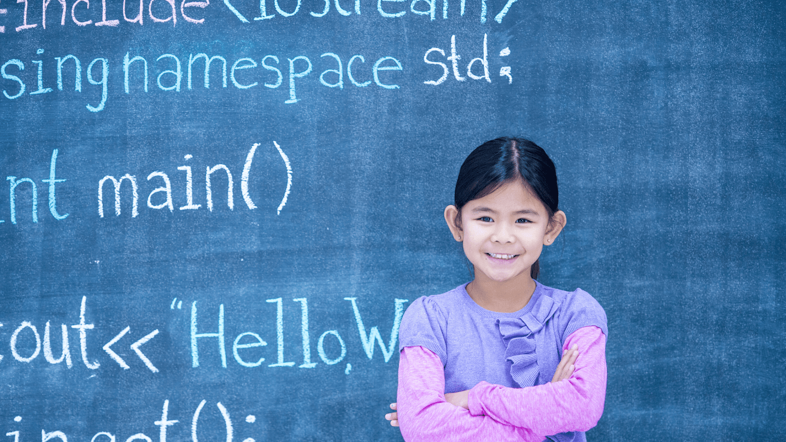 Girl smiling learning how to break down code into smaller parts