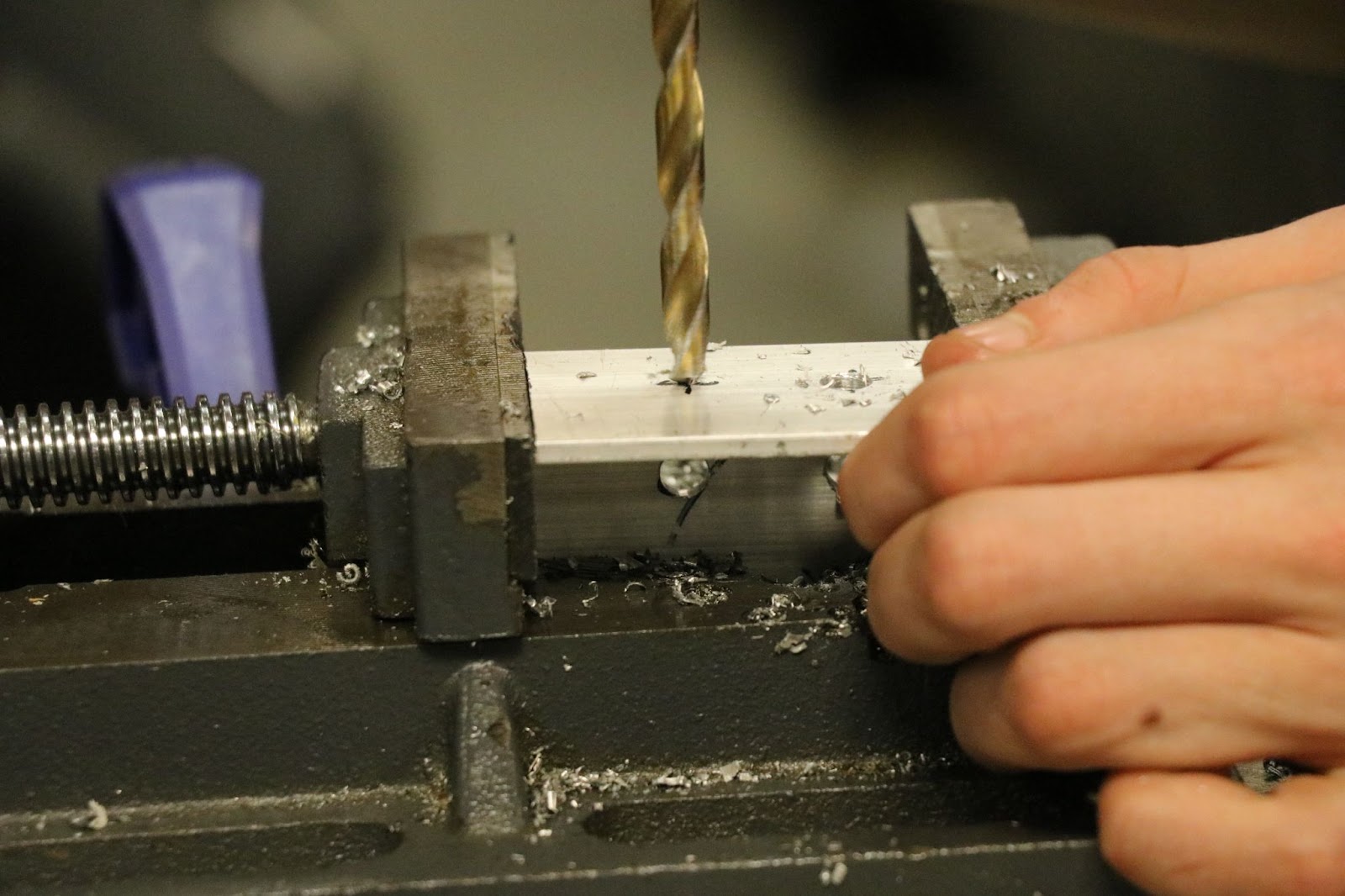 The drill press in use