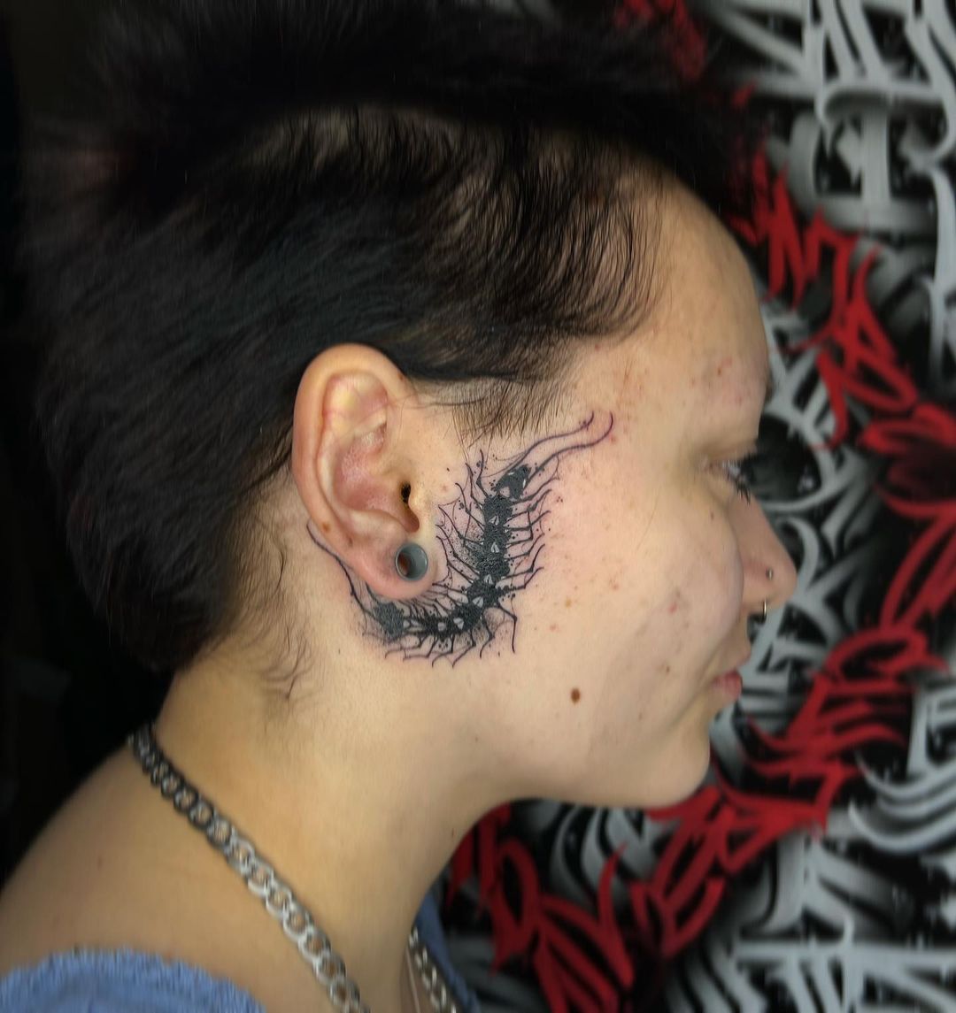 beautiful side ear tattoo
