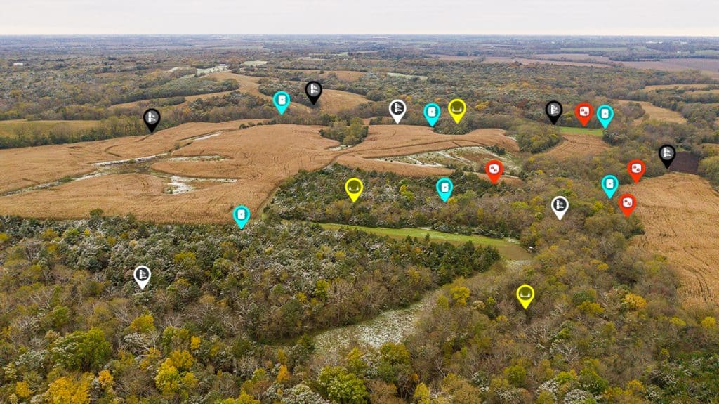 An aerial landscape with onX Hunt waypoints marketing various features.