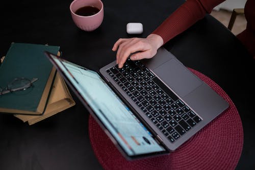 Free A Person using Laptop Stock Photo