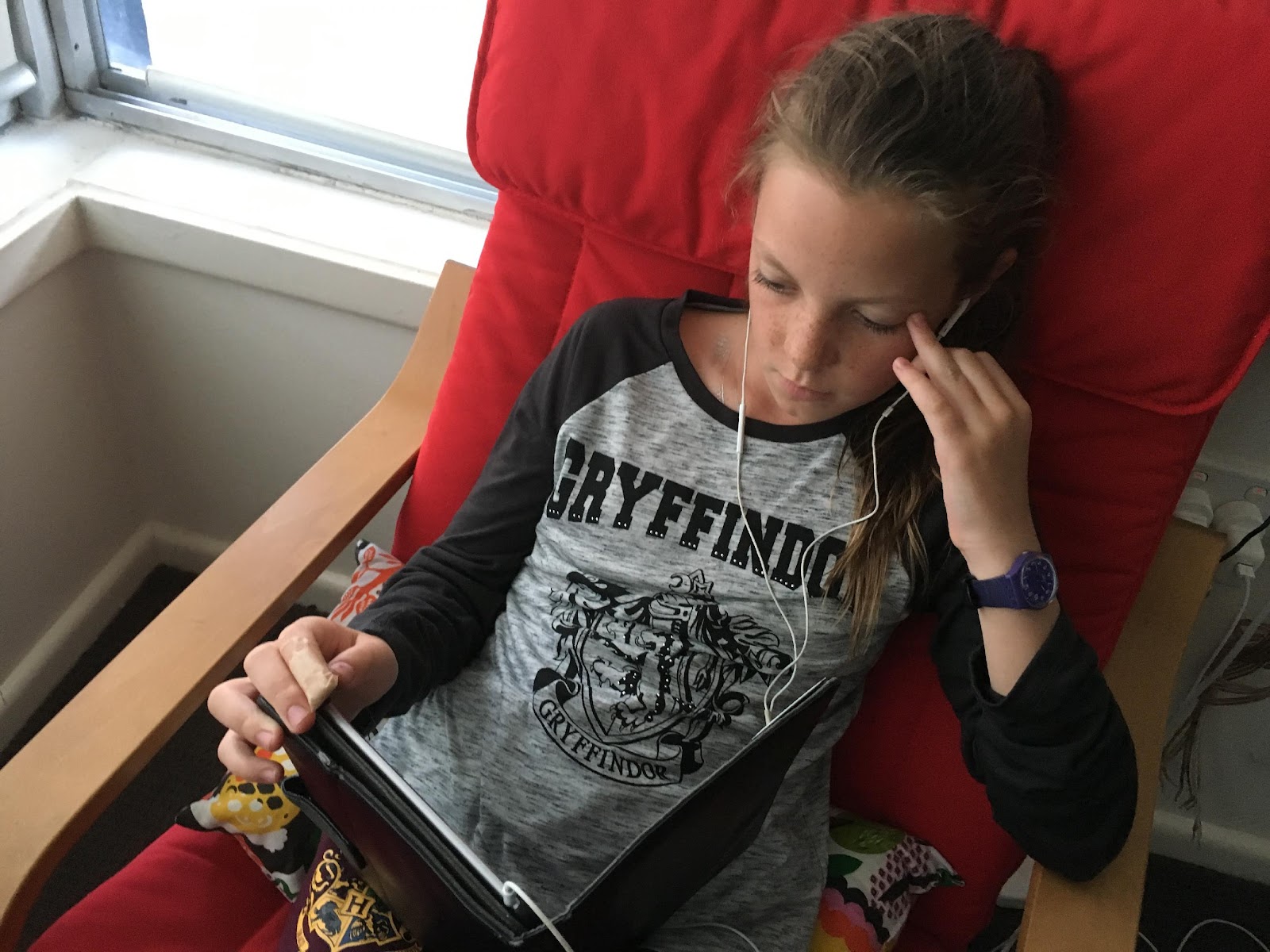 Tween Girl watching Ipad wearing Harry Potter tween wear