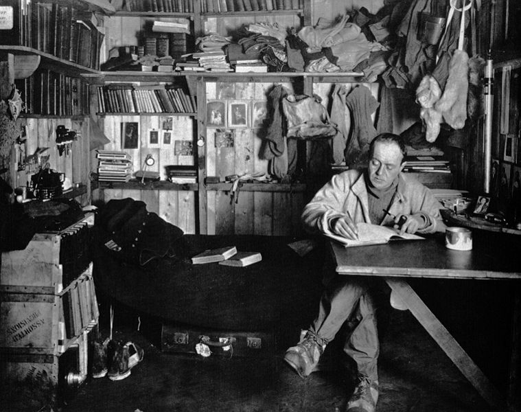 Vintage man sitting and writing a book.