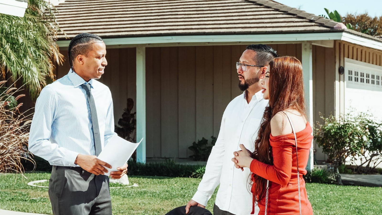 a couple talking with a real estate professional