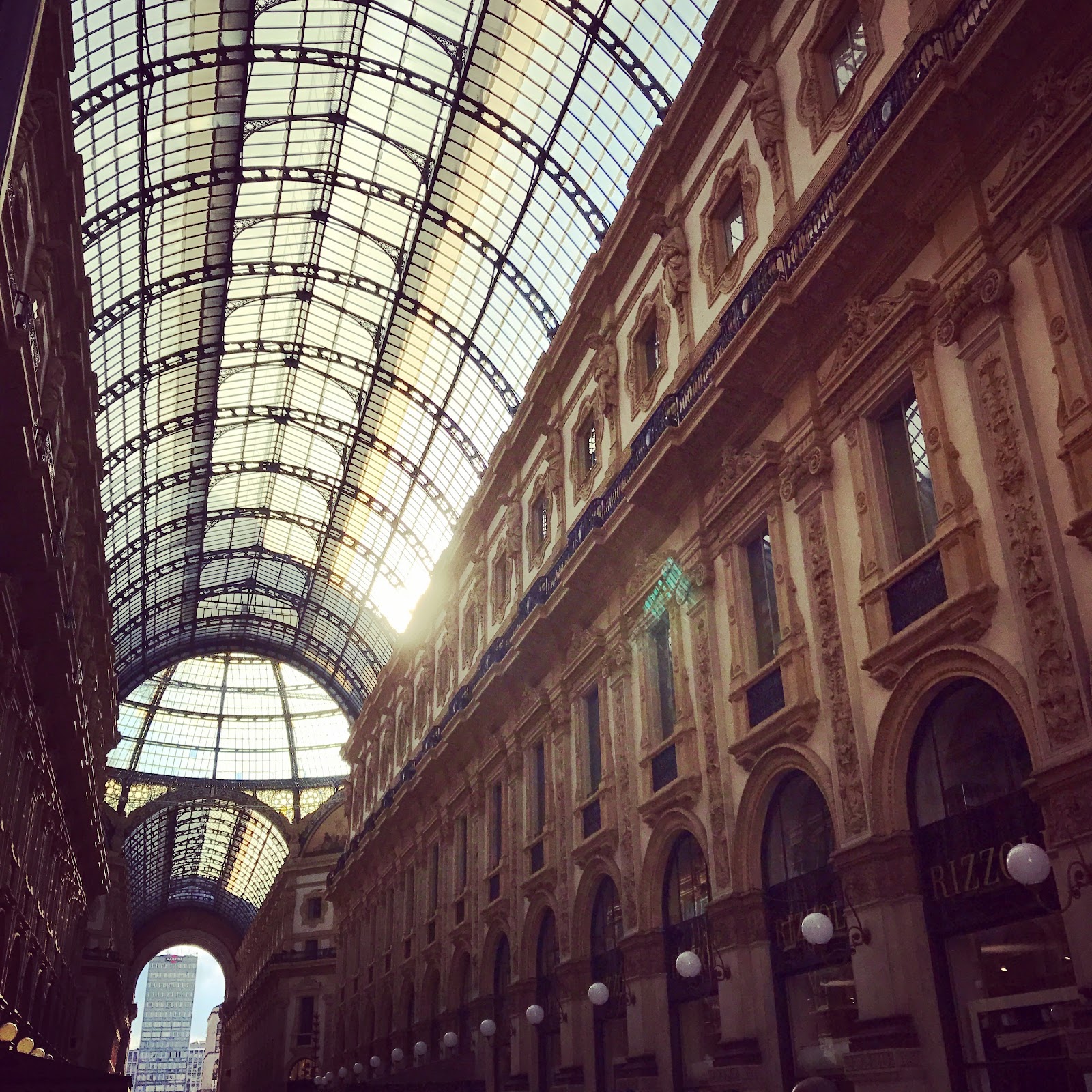 milan Galleria Vittorio Emanuele II, famous tourist site at piazza duomo. Grand architecture and glass ceiling hosts luxury boutiques and is one of the highlights of milano. see it on an Italy road trip