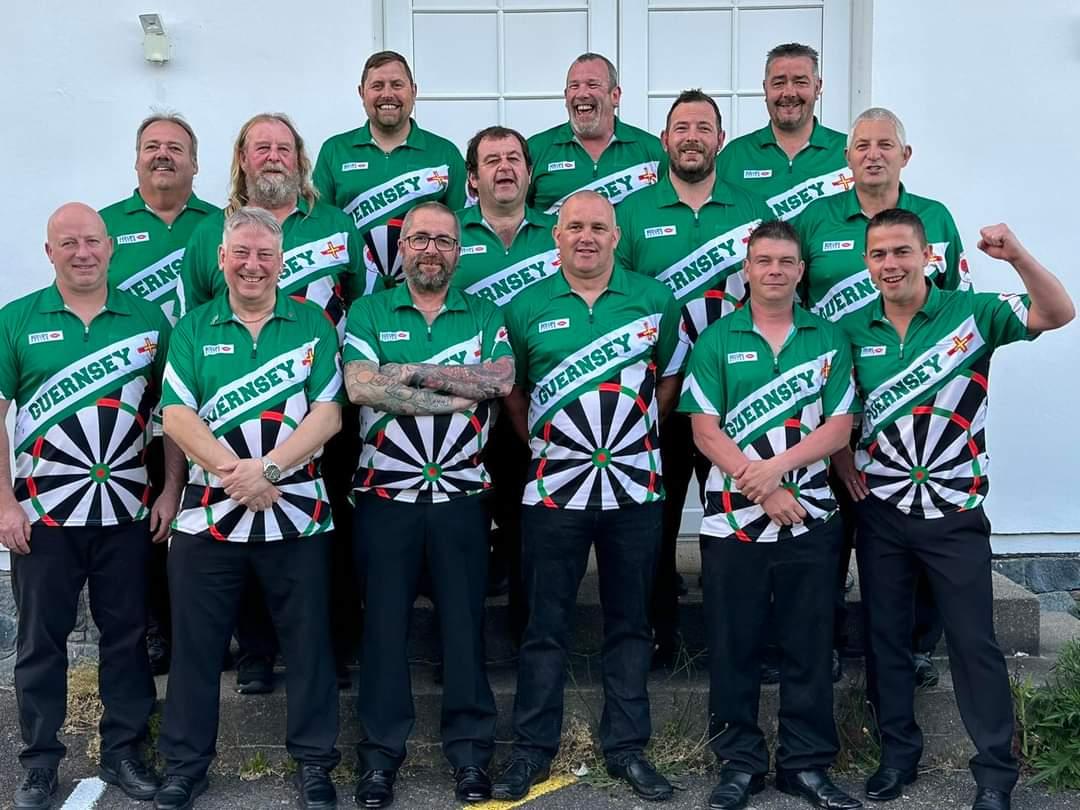 A group of men in matching green shirts
Description automatically generated with medium confidence
