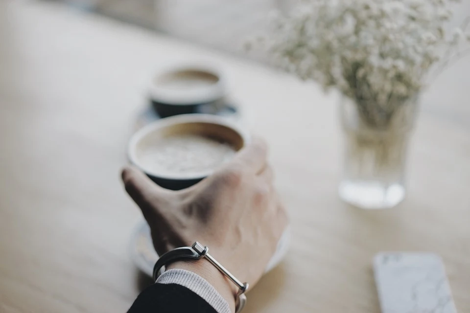 hand holding coffee cup