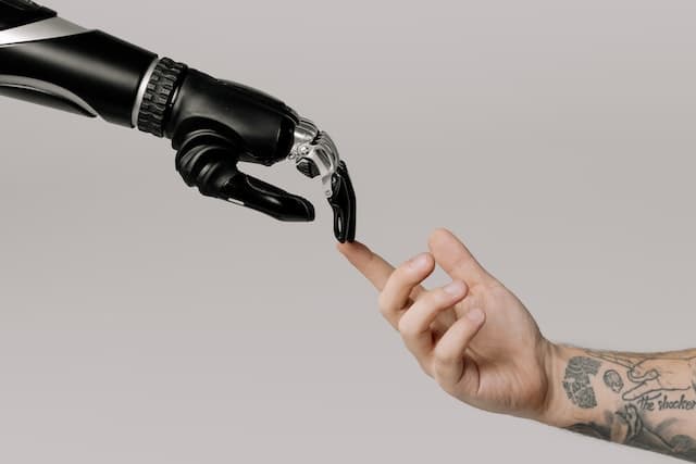 human shaking hand with a robot