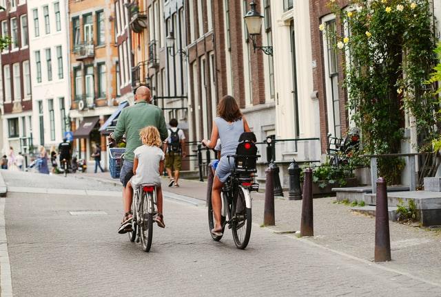 a family riding bikes as one of the healthy habits for the whole family